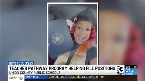 WBTV Screenshot of UCPS teacher holding diploma